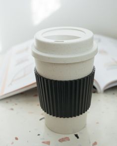 a coffee cup sitting on top of a table