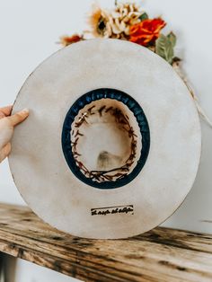 This burnt, distressed, felt fedora hat is a size Medium (57 cm around). This hat graphic of a cowboy roping in the desert is drawn into the hat and burned. The hat band is a genuine leather band with a genuine leather feather accent. This hat is burnt so it might have a slight smell for a few weeks.All feathers are glued to hold on the hat.FREE SHIPPING ON ALL OUR HAT ORDERS!All hats are branded by ©The Kiersten Zile CollectionNeed a Custom order? Message the Shop and we can start on that for y Burned Fedora Hat, Fedora Hat Burning, Wood Burned Felt Hat, Burnt Felt Hat Design, Cowboy Hat Embroidery, Best Hats For Men, Fedora Felt Hat With Feathers For Western-themed Events, Cowboy Roping, Cowboy Hat Design