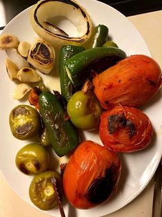 an assortment of vegetables on a white plate