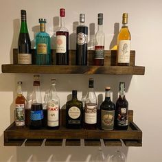 there are many bottles of alcohol on the shelves