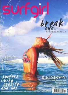 a magazine cover with a woman in the water on it's front page and an advertisement for surfgirl