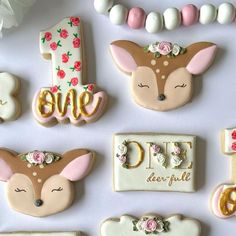 decorated cookies are arranged in the shape of animals