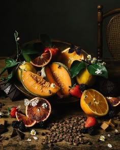 a bowl filled with sliced fruit on top of a wooden table next to coffee beans