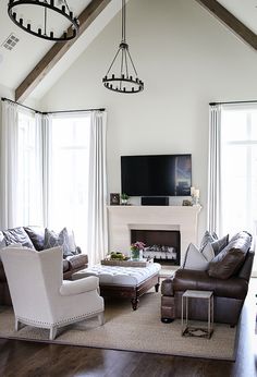 a living room filled with furniture and a fire place