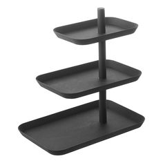 three tiered trays with black plastic on each side and one shelf holding two different items