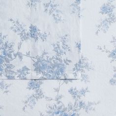 two sheets with blue flowers on them