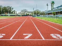 an empty running track with numbers painted on it