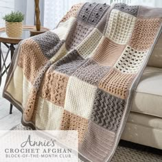 a crochet afghan is shown on a couch