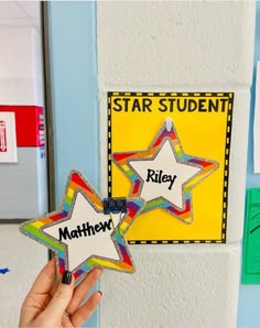 two star shaped magnets with words on them in front of a bulletin board that says, star student