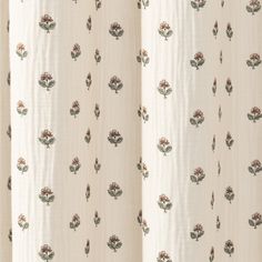 a white curtain with flowers on it