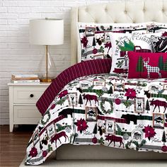 a bed with red and green christmas decorations on it