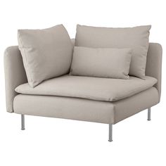 a white couch with two pillows on it's back and one arm folded up