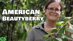 a woman in glasses standing next to a tree with berries on it and the words american beauty above her