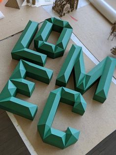 the letters are made out of green paper