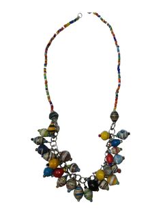 This fun and colourful necklace is hand made using recycled paper beads from Uganda. The beads are made by a woman's group in Jinga. Adjustable size, as it can be closed with the hook on any link. There is a matching bracelet available, please see bracelet listing. Each bead is hand-rolled from recycled paper and hardened with glue and varnish. The beads are made by woman who live in rural areas, many who rely on the money earned from making the beads to provide for their families needs such as Paper Bead Jewelry Necklaces, Hippie Hand-strung Multicolor Necklace, Recycled Paper Beads, African Paper Beads, Paper Necklace, Paper Bead Necklace, Bohemian Multicolor Hand-strung Necklace, Paper Jewellery, Paper Beads Necklace