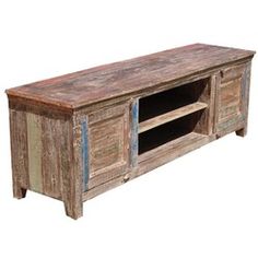 an old wooden tv stand with two doors and one open door on the bottom shelf