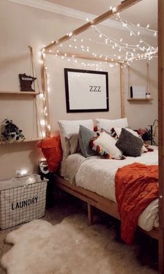 a bed room with a neatly made bed and string lights