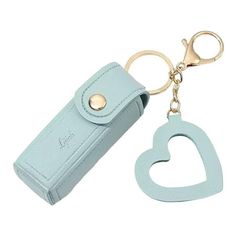 a heart shaped keychain with a leather case