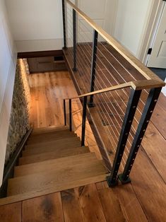 a wooden and metal stair case in a house