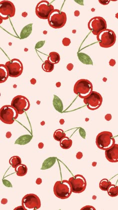 a pattern with cherries and leaves on a pink background