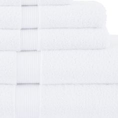 six white towels stacked on top of each other