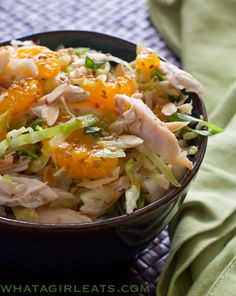 a black bowl filled with food on top of a table