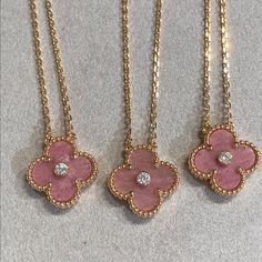 This Clover Rhodonite Necklace features a stunning diamond set in a luxurious pink gold setting. The unique design is both elegant and eye-catching, making it the perfect accessory for any occasion. Crafted with precision and showcasing the healing properties of rhodonite, this necklace adds sophistication and positive energy to any outfit. ADDITIONAL INFORMATION Color: Pink Gold Stone: Cubic Zirconia, Rhodonite Material:925 Sterling Silver - 18k Gold Plated- 18k Real Gold ( contact us via insta Pink Van Cleef Necklace, Sweet Alhambra Necklace, Rhodonite Necklace, Thigh Jewelry, Alhambra Necklace, Pink Gold Necklace, Van Cleef And Arpels Jewelry, Clover Design, Trendy Necklace