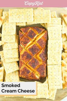 a plate with crackers and cheese on it, including an image of smoked cream cheese