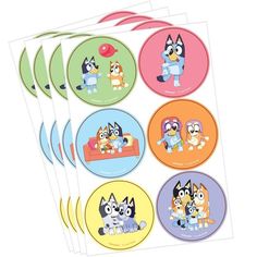 four stickers with cartoon dogs on them, one has a cat and the other has a dog