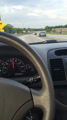 the dashboard of a car on a highway