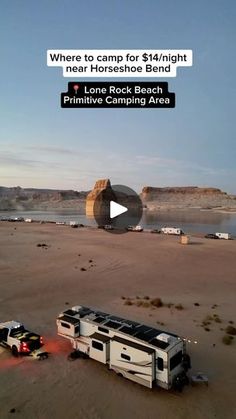 an rv is parked in the middle of a desert with a hot air balloon flying over it