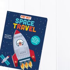 the pop out space travel book is open to reveal an image of a rocket ship