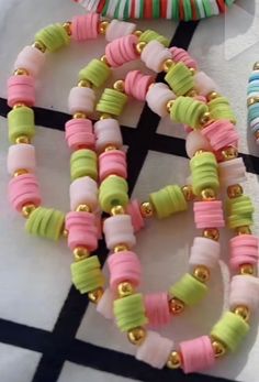 two bracelets with different colored beads on them