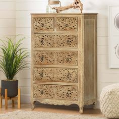 an ornate wooden chest of drawers in a living room