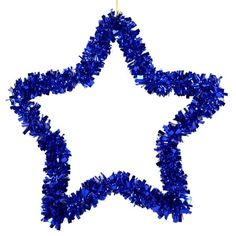 blue tinsel star ornament on white background