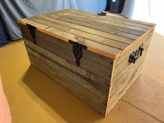 a wooden box sitting on top of a floor