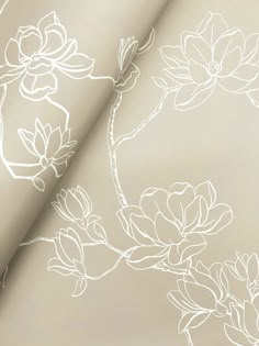 an image of a white flower pattern on a beige background