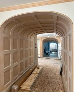 an archway leading into a room with wood trimming