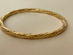 "Monet twisted wire gold plated bangle bracelet marked: copyright symbol Monet S diameter - 2 1/4\" ( marked S, size S ) Very good to excellent conditiion 000603" Adjustable Gold Spiral Bangle, Adjustable Spiral Gold Bangle, Yellow Gold Hoop Bracelets, Elegant Gold Spiral Cuff Bracelet, Elegant Gold Spiral Bracelet, Elegant Spiral Metal Bangle, Elegant Gold Spiral Bangle, Flexible Gold Bangle, Gold Bangles For Women