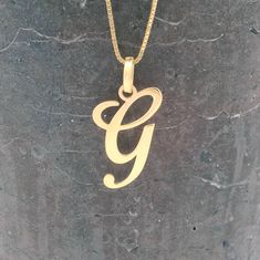 Elevate your style with our stunning 14k Gold Initial Necklace! This minimalist G pendant adds a touch of elegance to any outfit. Perfect for everyday wear or as a heartfelt gift, this personalized gold letter jewelry showcases your uniqueness. Shine bright and cherish special moments with this beautiful keepsake! - Material: 14K solid gold (not plated and not gold filled) - Pendant Thickness: 0.5mm=0.019inch - Jump ring diameter: 4mm = 0.15 inch - Punch: 585 = 14kt     A hallmark 585 (stamp) of 14k Gold Initial Necklace, Gold Initial Necklace, Letter Jewelry, Gold G, Jewelry Showcases, Gold Letter, Initial Necklace Gold, Necklace Minimalist, Gold Initial