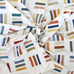 multicolored striped fabric with white background