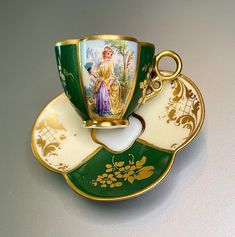 a cup and saucer with an image of a woman on it