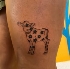 a cow with four leaves on it's back leg is shown in black ink