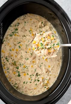 a crock pot filled with chicken and corn soup, ready to be cooked in the slow cooker