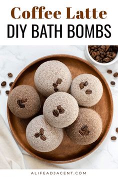 Coffee latte DIY bath bombs arranged on wooden plate, garnished with coffee beans. Text overlay: coffee latte DIY bath bombs. Coconut Milk Latte, Coffee Bath, Diy Bath Bomb, Coffee Essential Oil, Bath Bomb Ingredients, Homemade Beauty Recipes