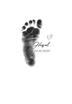 a black and white photo of a baby's foot with the words angel written on it