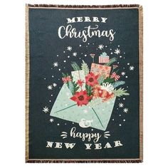 a merry christmas card with an envelope and flowers on the front, says happy new year