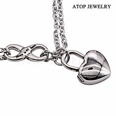 a heart shaped locke on a chain with the words attop jewelry written below it