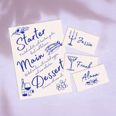 three blue inked menu cards with wine glasses