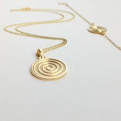 Round Spiral necklace, made of high-quality 14k gold plated chain. Dainty necklace appropriate for both everyday or special looks.  Spiral is the symbol of infinity and eternal existence.  Ideal anniversary gift! Also available in 925 Sterling Silver option.  Complete the set:  https://www.etsy.com/listing/1104147517/spiral-bracelet-bracelet-in-14k-gold?click_key=7ef248893cbaf975dd7625d86705068a8dbea0d2%3A1104147517&click_sum=afbaa32d&ref=shop_home_active_8&pro=1&frs=1 https://www.etsy.com/listi Handmade Spiral Yellow Gold Jewelry, Gold Plated Spiral Jewelry, Handmade Gold Swirl Jewelry, Gold Handmade Swirl Jewelry, Handmade Swirl Shaped Gold Jewelry, Minimalist Gold Spiral Jewelry, Gold Swirl Handmade Jewelry, Gold Swirl-shaped Handmade Jewelry, Gold Spiral Necklace As A Gift